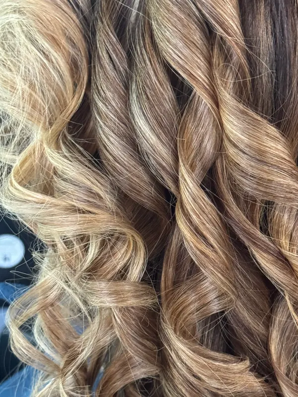 Close on the mid lengths: cool blonde ribbons threaded through a brown base
