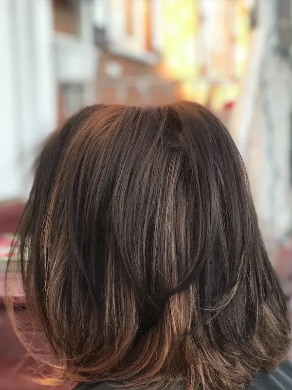 Blunt lob cut to one length, seen from the back