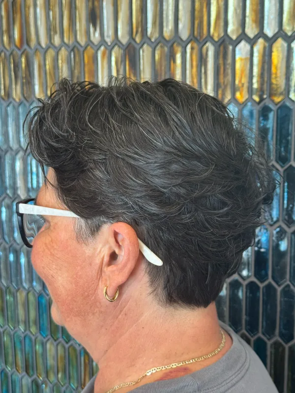 The same cut from behind the ear, sides kept close and the top left with movement